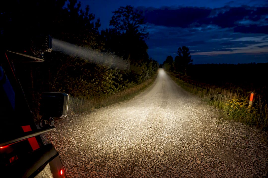 Flood and spot beams on rural roadside