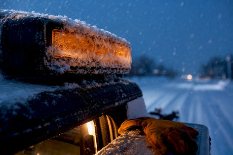 Snow crust forming on an anonymous light bar lens